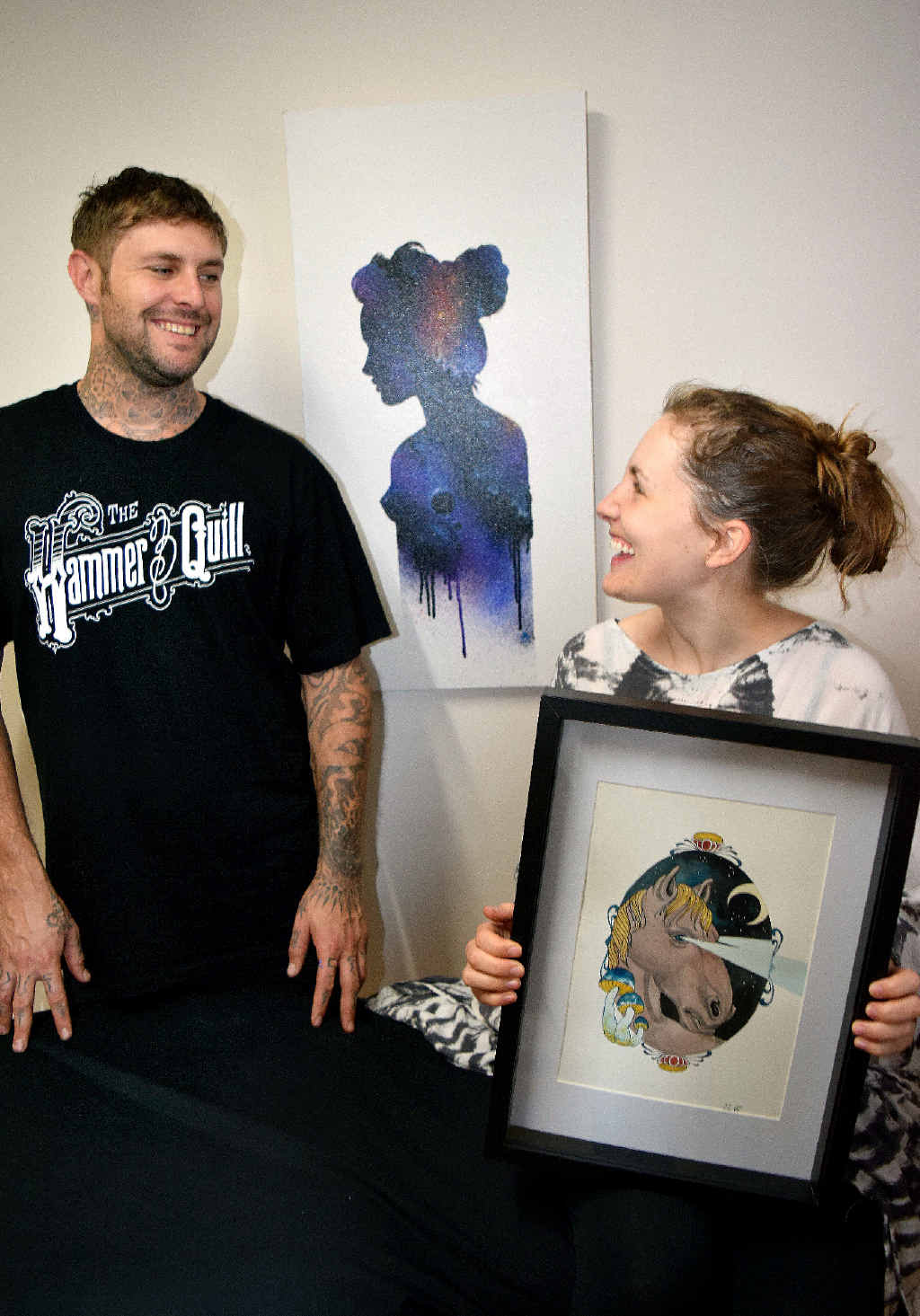 UP FOR GRABS: Anthony Alexander and Rebecca Sutherland from tattoo parlour Hammer and Quill in Alstonville with artwork which will be auctioned at a Mat Lee fundraiser. UP FOR GRABS: Anthony Alexander and Rebecca Sutherland from tattoo parlour Hammer and Quill in Alstonville with artwork which will be auctioned at a Mat Lee fundraiser.
